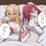  2girls blonde_hair blush breasts closed_eyes clothes_lift dark-skinned_female dark_skin elf hand_under_clothes head_on_pillow highres holding holding_phone hololive houshou_marine long_hair lying midriff multicolored_hair multiple_girls on_back on_side open_mouth phone pointy_ears red_eyes red_hair scratching_back shimaketa shiranui_flare shirt shirt_lift speech_bubble streaked_hair t-shirt translation_request under_covers virtual_youtuber yuri 