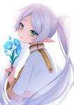  1girl absurdres blue_flower capelet drop_earrings earrings elf flower frieren green_eyes grey_hair highres holding holding_flower jewelry long_hair looking_at_viewer murmoruno pointy_ears solo sousou_no_frieren twintails white_background white_capelet 