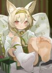  animal_ears arknights barefoot beanstalk_(arknights) blonde_hair blush braid christmas feet highres looking_at_viewer no_shoes red_eyes sakurami_sumi single_bare_leg single_sock socks socks_removed soles sweat toes white_socks 