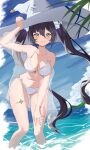  1girl atto_illust bikini black_hair blue_sky breasts closed_mouth cloud day genshin_impact green_eyes hand_on_headwear hat highres long_hair looking_at_viewer medium_breasts mona_(genshin_impact) navel ocean outdoors sky smile solo stomach swimsuit thigh_strap very_long_hair wading water white_bikini white_headwear witch_hat 