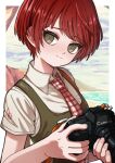  1girl border breasts camera cheeseko closed_mouth collared_shirt danganronpa_(series) danganronpa_2:_goodbye_despair freckles green_eyes holding holding_camera koizumi_mahiru necktie palm_leaf plaid_necktie red_hair shirt short_hair short_sleeves small_breasts smile solo upper_body white_border white_shirt 