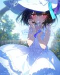  1girl black_hair blue_sky blurry blurry_foreground blush breasts bush commentary covering_mouth cowboy_shot dress fence flower hands_up hat holding_wind_chime idolmaster idolmaster_shiny_colors large_breasts looking_at_viewer morino_rinze official_alternate_costume outdoors red_eyes see-through see-through_sleeves short_hair sky solo soriya sun_hat sunflower tree twitter_username white_dress white_headwear wind_chime 