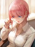  1girl blue_eyes breasts cleavage collared_shirt commentary_request curtains go-toubun_no_hanayome hair_between_eyes highres indoors ishiyuki large_breasts long_sleeves nakano_ichika pink_hair shirt short_hair sitting solo upper_body white_shirt 