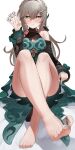  1girl absurdres bare_legs bare_shoulders barefoot between_fingers between_toes blush breasts brown_hair cleavage_cutout clothing_cutout crossed_legs dress eyelashes feet feibai foreshortening full_body green_dress green_eyes hair_intakes hair_ornament hand_up highres holding honkai:_star_rail honkai_(series) large_breasts legs long_hair long_sleeves looking_at_viewer mahjong mahjong_tile nail_polish on_ground qingque_(honkai:_star_rail) shoulder_cutout sitting smell soles solo steaming_body teeth toenail_polish toenails toes 