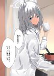  1girl absurdres animal_ears blue_archive cooking_pot cup disuto grey_eyes grey_hair halo highres holding holding_cup long_sleeves looking_at_viewer medium_hair mug shiroko_(blue_archive) shirt stove translation_request white_shirt wolf_ears wolf_girl 