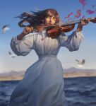  1girl absurdres bird_wings blurry blurry_background bow_(music) chinese_commentary clear_sky closed_eyes dress gem highres instrument jewelry liu2e3ing long_hair mountainous_horizon music necklace ocean original petals playing_instrument puffy_sleeves red_gemstone red_lips sky solo violin white_dress wings 