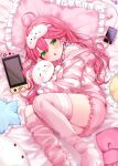  1girl absurdres candy cellphone food green_eyes hair_between_eyes hair_ornament hairclip highres hololive ineka_ka long_sleeves lying mask nintendo_switch open_mouth phone pillow pink_hair pink_hood pink_shorts pink_thighhighs sakura_miko shirt shorts smartphone solo striped striped_shirt stuffed_animal stuffed_cat stuffed_toy thighhighs virtual_youtuber 
