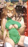  1girl anima_(togashi) animal_ear_fluff animal_ears blonde_hair blush breasts china_dress chinese_clothes clothing_cutout dress fangs fox_ears fox_girl fox_tail green_dress green_eyes high_ponytail highres large_breasts long_hair looking_at_viewer open_mouth original petals sitting skindentation slit_pupils smile solo tail thighhighs underboob underboob_cutout white_thighhighs 