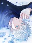  1boy blue_eyes blue_flower blue_petals closed_mouth commentary fingernails flower gojou_satoru ha_mmmu hand_up jujutsu_kaisen long_sleeves looking_at_viewer lying male_focus on_back petals petals_on_liquid short_hair solo upper_body white_hair 