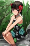  1girl absurdres bare_arms bare_shoulders black_dress black_hair blush brown_eyes closed_mouth dress feet_out_of_frame floral_print flower hair_flower hair_ornament highres looking_at_viewer matsunaga_kouyou nose_blush original print_dress red_flower sitting sleeveless sleeveless_dress smile soaking_feet solo water 