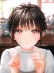  1girl absurdres backlighting black_hair blurry blurry_background blush breasts check_commentary coffee_mug commentary commentary_request cup hair_bun highres holding holding_cup indoors looking_at_viewer medium_breasts mug ojay_tkym original parted_lips portrait red_eyes signature solo sunlight window 