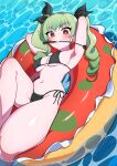  1girl absurdres afloat anchovy_(girls_und_panzer) arms_behind_head arms_up bikini black_bikini black_ribbon breasts closed_mouth commentary drill_hair girls_und_panzer green_hair hair_ribbon highres innertube knee_up long_hair looking_at_viewer lying medium_breasts mouth_hold navel on_back on_innertube red_eyes ribbon riding_crop side-tie_bikini_bottom solo swimsuit tenpura32200 twin_drills twintails water 