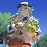  1boy ^^^ baseball_cap blue_eyes brown_pants collared_shirt commentary_request crossed_bangs day from_below green_hair hair_between_eyes hat highres holding holding_pokemon jewelry long_hair male_focus n_(pokemon) nagiru necklace outdoors pants pokemon pokemon_(creature) pokemon_(game) pokemon_bw ponytail shirt skwovet sky smile smoliv sweatdrop tree twitter_username undershirt watermark white_shirt wristband 