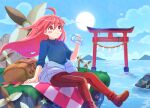  1girl :3 backpack bag black_footwear black_shirt blue_sky bottle celeste_(video_game) cloud cloudy_sky coat denim down_jacket fuwamoko_momen_toufu highres holding holding_bottle jacket jeans lake long_hair madeline_(celeste) nature open_clothes open_coat outdoors pants picnic red_hair shirt sitting sky sun temple_gate torii very_long_hair water_bottle wind 