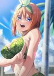  1girl absurdres bikini blue_eyes blush breasts commentary_request go-toubun_no_hanayome green_bikini highres large_breasts looking_at_viewer nakano_yotsuba navel orange_hair outdoors salute slope_(check238) smile solo swimsuit two-finger_salute upper_body water_drop watermark 