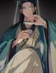  1boy black_background black_hair chinese_clothes chinese_hairpin cup facial_mark forehead_mark gradient_background green_eyes green_ribbon green_robe hair_ribbon highres holding holding_cup layered_clothes layered_sleeves long_hair male_focus ren_zhafan_paijizu_xitong ribbon robe sakuramochi1003 serious shen_qingqiu simple_background sitting solo 