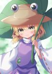  1girl absurdres animal_print blonde_hair blurry blurry_background blush bright_pupils day flat_chest frog_print giant_leaf hat high_meron highres holding holding_leaf leaf long_sleeves looking_at_viewer medium_hair moriya_suwako outdoors purple_skirt purple_vest skirt skirt_set smile solo touhou turtleneck vest white_pupils wide_sleeves yellow_eyes 