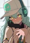  1girl absurdres antonina_(neural_cloud) aqua_hair baseball_cap black_gloves blurry blurry_background blush commentary girls&#039;_frontline girls&#039;_frontline_neural_cloud gloves hand_on_own_chin hat head_rest headphones highres jewelry long_hair messy_hair ring ryunosuke_nikaido single_glove skull_print smile symbol-only_commentary tearing_up upper_body wedding_ring yellow_eyes 