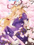  1girl blonde_hair breasts cherry_blossoms day dress elbow_gloves feet_out_of_frame folding_fan gloves hand_fan hat highres kirisita large_breasts long_hair looking_at_viewer mob_cap outdoors purple_dress sitting smile solo touhou very_long_hair yakumo_yukari yellow_eyes 