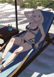  1girl absurdres arm_up beach beach_chair blue_shorts braid breasts brown_footwear cleavage cup day drinking_glass drinking_straw food fruit green_eyes grey_hair highres hololive hololive_fantasy large_breasts looking_at_viewer medium_hair navel orange_(fruit) orange_slice outdoors pinoj0214 sand shirogane_noel shorts sitting solo swimsuit virtual_youtuber 