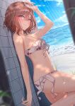  1girl absurdres arm_up beach bikini blurry blurry_foreground blush breasts brown_hair depth_of_field dutch_angle fingernails halterneck highres higuchi_madoka idolmaster idolmaster_shiny_colors looking_at_viewer looking_to_the_side medium_breasts mole mole_under_eye nail_polish outdoors paid_reward_available red_eyes smile solo standing standing_on_one_leg swimsuit tile_wall tiles white_bikini yzk_knmn 