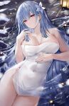  1girl absurdres age_fx azur_lane blue_hair breasts closed_mouth covered_navel flower hair_between_eyes hair_flower hair_ornament highres lantern large_breasts long_hair looking_at_viewer lying naked_towel official_alternate_costume on_back onsen purple_eyes solo towel voroshilov_(azur_lane) voroshilov_(devoted_as_the_warm_snow)_(azur_lane) water 