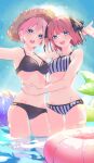  2girls arms_at_sides ball beachball bikini black_bikini blue_eyes breasts butterfly_hair_ornament collarbone go-toubun_no_hanayome hair_ornament hands_on_another&#039;s_waist highres inflatable_toy innertube looking_at_viewer medium_breasts medium_hair multiple_girls nakano_ichika nakano_nino open_mouth partially_submerged pink_hair purple_bikini short_hair siblings sisters striped striped_bikini swimsuit teeth thighs upper_teeth_only valentine_(02140314c) water 