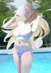  1girl absurdres alternate_costume asuna_(blue_archive) asymmetrical_bangs bikini blonde_hair blue_archive blue_bikini blurry blurry_background breasts cleavage collarbone floating_hair hair_over_one_eye halterneck highres large_breasts long_bangs long_hair looking_at_viewer navel one_eye_covered outdoors pool side-tie_bikini_bottom smile solo stomach string_bikini swimsuit tnr_(horiko1525) very_long_hair 