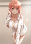  1girl aged_up blush breasts cleavage closed_mouth collarbone collared_shirt commentary_request dars_(recolors) hand_up highres large_breasts long_hair long_sleeves looking_at_viewer naked_shirt pink_hair red_eyes shirt smile solo white_shirt yahari_ore_no_seishun_lovecome_wa_machigatteiru. yuigahama_yui 