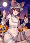  1girl animal_ears bandages breasts brown_hair building candy cat_ears cat_girl cat_tail food full_body halloween halloween_costume highres jack-o&#039;-lantern kida_kuro_mu naked_bandage navel night orange_eyes original short_hair sitting slit_pupils small_breasts stomach tail 