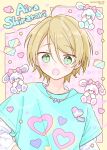  1boy blonde_hair blush character_name ensemble_stars! green_eyes green_shirt happypuppy_guu heart highres jewelry long_sleeves looking_at_viewer male_focus necklace open_mouth pink_background shiratori_aira_(ensemble_stars!) shirt short_hair short_sleeves solo star_(symbol) stuffed_animal stuffed_rabbit stuffed_toy white_shirt yellow_background 