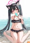  1girl absurdres animal animal_ears bare_arms bare_legs bare_shoulders barefoot beach bikini black_bikini black_hair blue_archive blush cat_ears collarbone fanteam flat_chest food frilled_bikini frills hair_between_eyes halo highres holding holding_food long_hair looking_at_viewer navel ocean official_alternate_costume pink_halo popsicle red_eyes serika_(blue_archive) serika_(swimsuit)_(blue_archive) shore sitting solo starfish swimsuit twintails wariza 