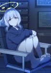  1girl absurdres armchair bare_legs barefoot blue_archive blunt_bangs blurry chair commentary_request computer cross_hair_ornament depth_of_field fukujin green_eyes grey_hair hair_ornament halo hare_(blue_archive) highres hood hooded_sweater hugging_own_legs indoors knees_to_chest knees_up long_hair long_sleeves looking_at_viewer monitor ponytail server sidelocks soles solo sweater 