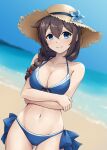  1girl bare_arms bare_legs bare_shoulders beach bikini blue_bikini blue_eyes blush braid breasts brown_hair cleavage closed_mouth collarbone cowboy_shot day groin hair_between_eyes hair_flaps hat highres kantai_collection kodama_(mmt_uf) large_breasts long_hair looking_at_viewer navel ocean official_alternate_costume outdoors shigure_(kancolle) shigure_kai_san_(kancolle) single_braid solo straw_hat swimsuit 