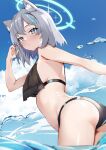  1girl absurdres animal_ear_fluff animal_ears ass blue_archive blue_eyes blush breasts cross_hair_ornament extra_ears grey_hair hair_ornament halo highres looking_at_viewer medium_breasts medium_hair mismatched_pupils nohohon_neko outdoors shiroko_(blue_archive) solo swimsuit thighs wading water wolf_ears 
