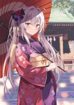  1girl blurry blurry_background blush commentary_request floral_print flower grey_hair hair_between_eyes hair_flower hair_ornament highres holding holding_umbrella japanese_clothes kimono long_hair looking_at_viewer new_year obi oil-paper_umbrella original outdoors ponytail purple_kimono rasahan red_eyes red_kimono revision sash solo umbrella wide_sleeves 