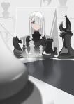 1girl 38_(sanjuuhachi) bishop_(chess) black_bow black_bowtie black_jacket board_game bow bowtie chess chess_piece chessboard expressionless grey_eyes hair_over_one_eye highres jacket king_(chess) knight_(chess) long_sleeves nier:automata nier_(series) pawn_(chess) queen_(chess) reflection rook_(chess) sitting solo white_hair yorha_type_a_no._2 