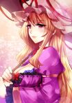  1girl breasts cleavage closed_mouth commentary_request from_side hat hat_ribbon holding holding_umbrella juliet_sleeves long_sleeves mob_cap nagare puffy_sleeves red_eyes red_ribbon ribbon solo touhou umbrella upper_body white_headwear yakumo_yukari 