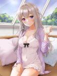  1girl absurdres alcohol azur_lane blonde_hair blue_eyes blush breasts ca_paria cleavage collarbone commentary_request couch covered_navel cup frills hand_up heterochromia highres holding holding_cup indoors jacket large_breasts long_hair long_sleeves looking_at_viewer murmansk_(azur_lane) murmansk_(sceneries_of_pure_snow)_(azur_lane) nightgown official_alternate_costume open_clothes open_jacket pillow purple_eyes purple_jacket revision sitting smile solo tree vodka white_nightgown window 