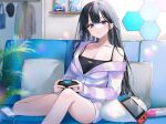  1girl :o bare_shoulders black_hair blue_camisole blush breasts camisole cleavage collarbone controller couch highres holding holding_controller indoors jacket large_breasts long_hair long_sleeves looking_at_viewer nekoyashiki_pushio nintendo_switch non-web_source off_shoulder original parted_lips pillow plant purple_eyes short_shorts shorts sitting solo spaghetti_strap white_jacket 