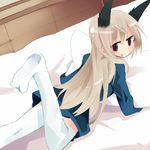  alternate_legwear animal_ears blonde_hair brown_eyes eila_ilmatar_juutilainen kanikama long_hair looking_back lying solo strike_witches thighhighs world_witches_series 