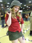  bazooka blonde_hair cosplay explosive female green_eyes grenade hair_ornament hairpin helmet photo red_team rocket skirt smile soldier team_fortress_2 tf2 the_soldier weapon 