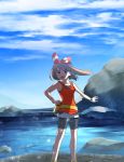  1girl bike_shorts black_shorts blue_sky bow brown_hair cloud creatures_(company) day floating_hair game_freak hair_bow hairband haruka_(pokemon) highres holding holding_poke_ball long_hair nintendo outdoors outstretched_arm poke_ball pokemon pokemon_(game) pokemon_oras red_hairband shirt short_shorts shorts shorts_under_shorts sky sleeveless sleeveless_shirt solo standing striped striped_bow white_shirt white_shorts wristband yuihiko 