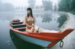  black_hair boat breasts fog highres lake long_hair medium_breasts nipples nude photo solo watercraft 