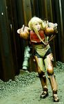  blonde_hair cosplay long_hair metroid photo power_armor samus_aran solo varia_suit watermark 