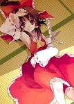  arm_up armpits bare_shoulders bow brown_hair detached_sleeves from_above gohei hair_bow hair_tubes hakurei_reimu hands koto_(colorcube) long_hair lying on_back ponytail red_eyes smile solo tatami touhou 