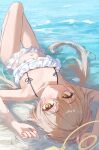  1girl absurdres alpha_beast bare_arms bare_legs bare_shoulders bikini blue_archive blush closed_mouth frilled_bikini frills hair_between_eyes halo hifumi_(blue_archive) hifumi_(swimsuit)_(blue_archive) highres light_brown_hair long_hair looking_at_viewer low_twintails lying official_alternate_costume on_back solo swimsuit twintails water white_bikini yellow_eyes yellow_halo 