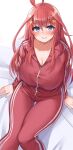  1girl ahoge blue_eyes blush breasts cleavage collared_jacket commentary_request embarrassed go-toubun_no_hanayome hair_ornament jacket large_breasts long_hair long_sleeves looking_at_viewer micosiva nakano_itsuki pants red_hair red_jacket red_pants sitting solo star_(symbol) star_hair_ornament track_jacket track_pants track_suit 