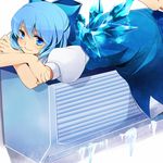  air_conditioner blue_eyes blue_hair bow cirno hair_bow ice lying mundane_utility nozomu144 on_stomach short_hair smile solo touhou wings 
