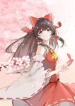  1girl ascot blurry blurry_foreground bow brown_eyes brown_hair cherry_blossoms detached_sleeves floating_hair flower frilled_bow frilled_hair_tubes frills hair_bow hair_tubes hakugyokurou_no_oojou-sama hakurei_reimu holding long_hair medium_skirt pink_flower print_bow red_bow red_shirt red_skirt ribbon-trimmed_sleeves ribbon_trim shirt skirt sleeveless sleeveless_shirt solo standing touhou very_long_hair white_sleeves wide_sleeves yellow_ascot 